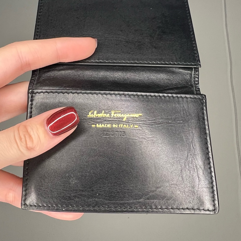 Salvatore Ferragamo  black leather wallet, made in Italy. Unisex.